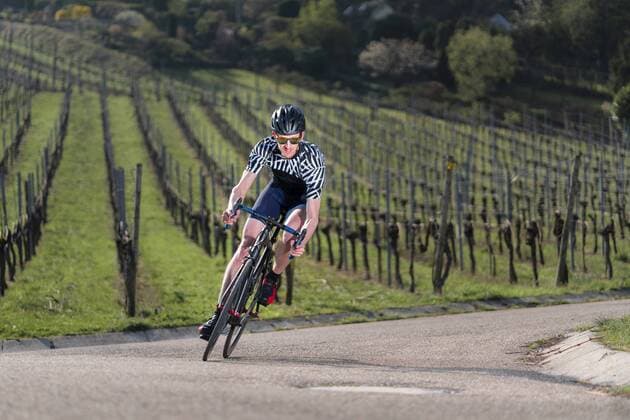 Germany, Baden-Wuerttemberg, Fellbach, man on racing cycle on country road through vineyards model released Symbolfoto  STSF01966