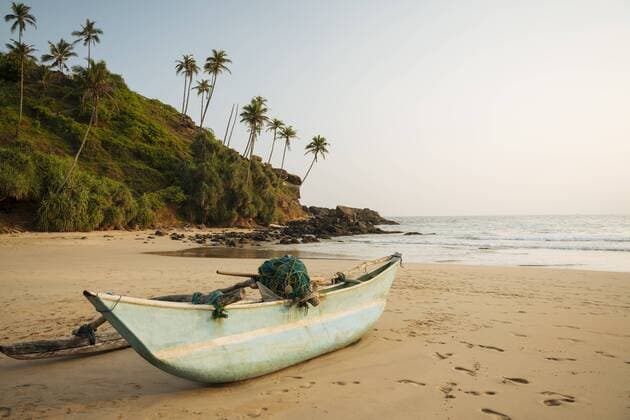 Traditional wooden boat on Talalla Beach at dusk, South Coast, Sri Lanka, Asia Copyright: BenxPipe 848-1818