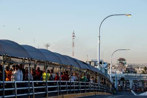 July 1, 2019 - Ciudad Juarez, Chihuahua, MEX - Pedestrians wait in line at the Paso del Norte Bride to cross into the United States to El Paso, Texas, while U.S. Customs and Border Protection and Border Patrol agents occupied the space blocking traffic after protests in the early morning took place in Ciudad Juarez, Chihuahua, Mexico. Agents began letting pedestrians to cross by checking identification one person at a time once the protests subsided. Ciudad Juarez MEX - ZUMAj106 20190701_zap_j106_004 Copyright: xJoelxAngelxJuarezx