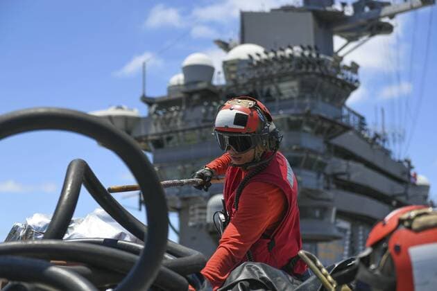 June 26, 2019 - San Diego, California, U.S. - Aviation Boatswain Mate (Handling) Airman George Seymour, from Upland, Calif., sorts through equipment during a mass casualty drill on the flight deck of the aircraft carrier USS Theodore Roosevelt (CVN 71), June 26, 2019. Theodore Roosevelt is homeported in San Diego. San Diego U.S. - ZUMAz03_ 20190626_sha_z03_117 Copyright: xU.S.xNavyx