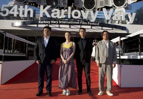 Actors Wang Yanhui, from left, and Zhang Tongxi, director Zhai Yixiang and producer Wang Zijian arrive to present Mosaic Portrait film at the 54th Karlovy Vary International Film Festival in Karlovy Vary, Czech Republic, on July 3, 2019. (CTKxPhoto KaterinaxSulova) CTKPhotoP201907031013201  suk2