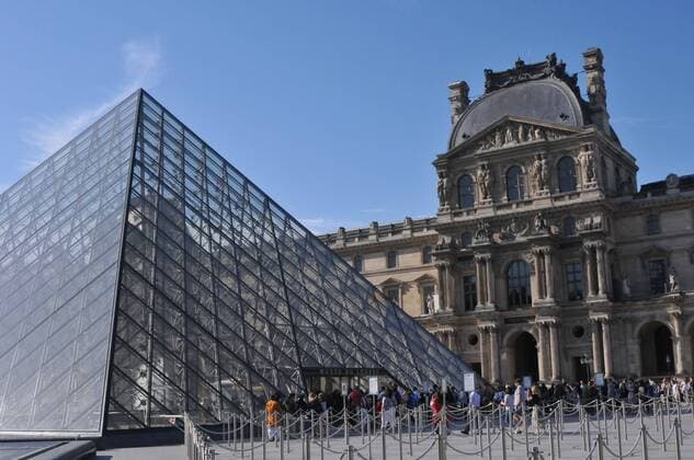 Paris France. 0 July 2019 Tourists visiting Musee du Louvre in and view Louvr pyramid in Paris France . (Photo..Francis Dean Deanpictures. 