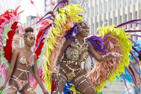 (190709) -- TORONTO, July 9, 2019 -- Dressed-up revelers perform during the official launch ceremony of the 2019 Toronto Caribbean Carnival in Toronto, Canada, July 9, 2019. The annual four-week cultural festival of Caribbean music, cuisine and revelry kicked off on Tuesday. King and Queen costume competition, Junior Carnival, Grand Parade and other events will be held during the festival. ) CANADA-TORONTO-CARIBBEAN CARNIVAL-LAUNCH CEREMONY ZouxZheng 