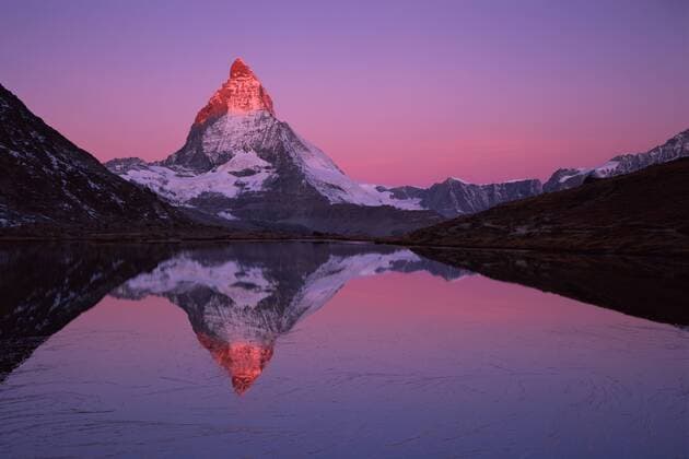 Matterhorn (4,478m) with reflection in Lake Riffel at sunrise, Switzerland, September 2008. WWE BOOK. WWE OUTDOOR EXHIBITION. NOT TO BE USED FOR GREETING CARDS OR CALENDARS *PRESS IMAGE  1281379 WildxWondersxofxEuropexPopp-Hackner