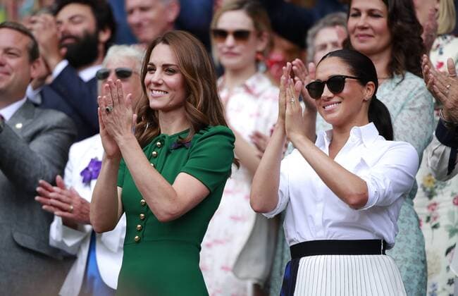 Kate Middleton (Duchess of Cambridge) and Meghan Markle (Duchess of Sussex) watch the Ladies Singles Final between Serena Williams and Simona Halep at The Wimbledon Championships tennis, Wimbledon, London on July 13, 2019 