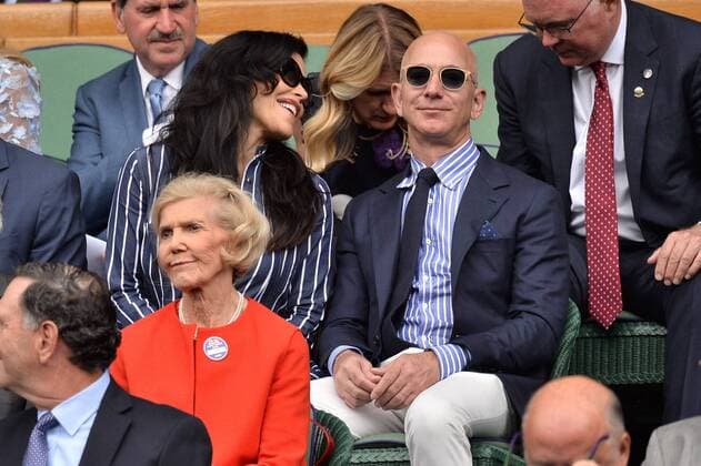 July 14, 2019 - London, London, UK - London, UK. CEO and president of Amazon. com Jeff Bezos and Lauren Sanchez arrive to watch the mens singles finals on centre court tennis on Day 13 of the Wimbledon Tennis Championships 2019 held at the All England Lawn Tennis and Croquet Club. London UK  - ZUMAl94_ 20190714_zaf_l94_032 Copyright: xRayxTangx