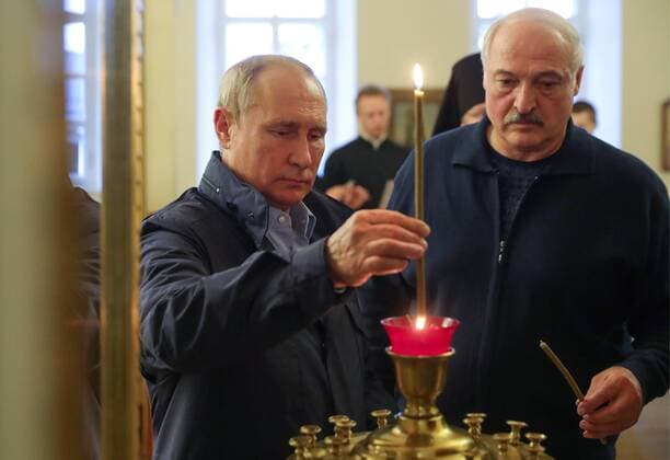 LENINGRAD REGION, RUSSIA - JULY 17, 2019: Russia s President Vladimir Putin (L) and Belarus President Alexander Lukashenko light candles on their visit to the Konevsky Monastery on Lake Ladoga. Mikhail Klimentyev Russian Presidential Press and Information Office TASS  TS0B3699