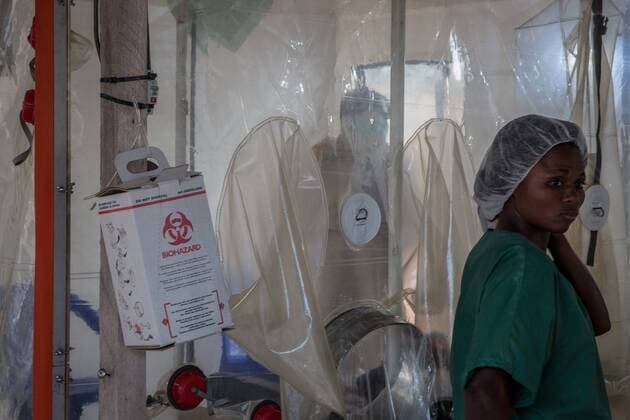 June 12, 2019 - Beni, Democratic Republic of Congo - A doctor wearing full protective gear speaks to a patient in the Ebola treatment centre in Beni, eastern Democratic Republic of the Congo..The DRC is currently experiencing the second worst Ebola outbreak in recorded history. More than 1,400 people have died. Beni Democratic Republic of Congo - ZUMAs197 20190612_zab_s197_038 Copyright: xSallyxHaydenx