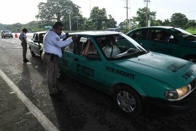 July 24, 2019, Tapachula, Chiapas, Mexico: Mexican immigration officers check IDs of commuters arriving into Tapachula city Wednesday. Hundreds of iilegal arrivals happen every day as the flow of migrants has moved to isolated spots along the Suchiate River, which marks the border between the two nations. Mexican President Lopez ObradorÃ¢â‚¬â ¢s administration claims to have reduced the flow of migrants looking to reach America, but much of the flow continues in remote border areas. Tapachula Mexico - ZUMAl113 20190724_zap_l113_005 Copyright: xMiguelxJuarezxLugox