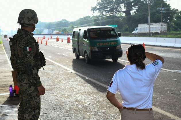 July 24, 2019, Tapachula, Chiapas, Mexico: Mexican marines and immigration officers check IDs of commuters arriving into Tapachula city on Wednesday. Hundreds of illegal arrivals still happen every day as the flow of migrants has moved to isolated spots along the Suchiate River, which marks the border between the two nations. Mexican President Lopez ObradorÃ¢â‚¬â ¢s administration claims to have reduced the flow of migrants looking to reach America, but much of the flow continues in remote border areas. Tapachula Mexico - ZUMAl113 20190724_zap_l113_007 Copyright: xMiguelxJuarezxLugox
