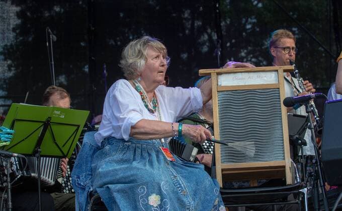 Viljandi, 25.07.2019 Fashion at the Viljandi Folk Music Festival. Orivesi All Stars o, Finland, performing. The festival takes place every July in the castle park and centre of Viljandi. It is the strongest expression of a special mindset originating from the early 1990s. This mindset values tradition, heritage, and a local identity and tries to adapt the spiritual values collected over hundreds and thousands of years with the modern way of living all of this to keep the traditions alive and thereby strengthen our national characteristics. Viljandi Folk Music Festival has become one of the largest festivals of this kind in the Baltic and Nordic countries over the years. Viljandi Estonia  Copyright: xElmoxRiigx