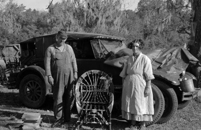 Migrant cane chair maker and wife in front of their automobile home, near Paradis, Louisiana 19380101 Migrant cane chair maker and wife in front of their automobile home, near Paradis, Louisiana, 19380101; by Russell lee, 1903-1986, Copyright: xPhoto12 AnnxRonanxPicturexLibraryx ARP16A01058