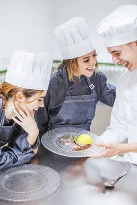 Junior chef showing his prepaired dessert on plate model released Symbolfoto property released  LJF00182
