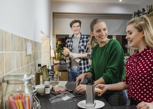  Friends Preparing Food for a Party ,model released, Symbolfoto,property released  Copyright: xDGLimagesx Panthermedia25858904