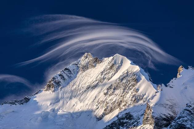 White cloud at dawn lights up Piz Bernina and Biancograt, Engadine, Canton of Graubunden, Engadine, Switzerland, Europe Copyright: RobertoxMoiola 1179-1678