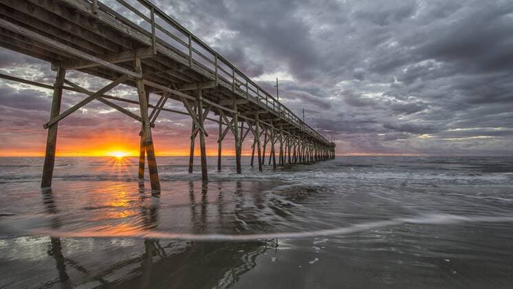 Beach, ocean, waves and pier at sunrise, Sunset Beach, North Carolina, United States of America, North America Copyright: JonxReaves 1241-31