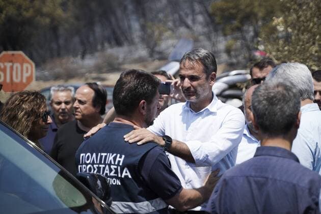 News Themen der Woche KW33 News Bilder des Tages (190815) -- ATHENS, Aug. 15, 2019 (Xinhua) -- Greek Prime Minister Kyriakos Mitsotakis inspects Makrymalli village, on Evia island, Greece, on Aug. 14, 2019. Amid ongoing efforts to extinguish a destructive wildfire, Greek Prime Minister Kyriakos Mitsotakis on Wednesday called for stronger cooperation among European Union (EU) members to tackle future natural disasters. He made the call during a visit to fire-stricken Evia island. Fanned by strong winds, the flames threatened villages some 80 kilometers northeast of Athens, forcing the evacuation of hundreds of residents on Tuesday. (Photo by Nick Paleologos Xinhua) GREECE-EVIA-WILDFIRE 