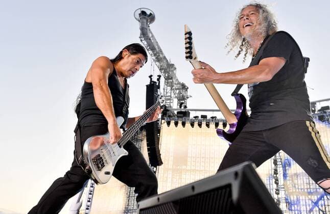 The Metallica heavy metal band opened its Prague concert for some 70,000 people with the Ecstasy of Gold song by Ennio Morricone from The Good, the Bad and the Ugly famous Spaghetti Western film on August 18, 2019. The band is visiting Prague within its WorldWired Tour, which started in Lisbon on May 1. On the photo perform R-L guitarist of the band Kirk Hammett and bass guitarist Robert Trujillo. (CTKxPhoto VitxSimanek) CTKPhotoP201908180549901  VIS 006
