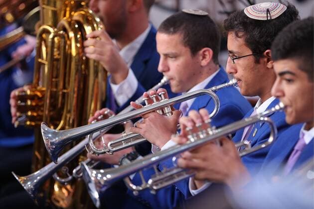 MOSCOW, RUSSIA - AUGUST 23, 2019: Young men take part in the Spasskaya Tower Festival of Children s Wind Bands at the Children Playground in Red Square as part of the 12th Spasskaya Tower International Military Music Festival. Mikhail Tereshchenko TASS  TS0B77C5