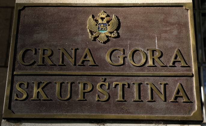 PODGORICA, MONTENEGRO - AUGUST 20, 2019: A sign outside the building of the Parliament of Montenegro (Skupstina) in Podgorica. Valery Sharifulin TASS  TS0B7779