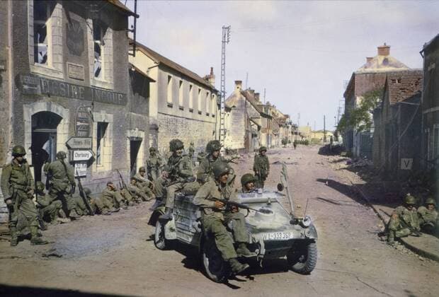 American Paratroopers in Captured German Jeep Patrolling Carentan while other American Soldiers Rest against a Building, Normandy, France, June 1944  Copyright: xJTxVintagex jtv011709