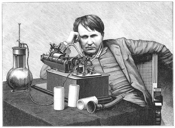 Thomas Alva Edison (1847-1931) American inventor, listening to a recording on his phonograph. This is an electric model powered by a bichromate cell (left), a form of wet battery. Engraving c1895 Photos12.com - Ann Ronan Picture Library Copyright: xPhoto12 AnnxRonanxPicturexLibraryx ARP07110460001551