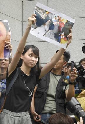 Hong Kong democracy activist Democracy activist Agnes Chow takes part in an anti-government demonstration at which protesters surrounded Hong Kong s police headquarters on June 21, 2019. Chow and her fellow activist Joshua Wong were arrested on Aug. 30 for allegedly inciting and organizing an unlawful assembly on June 21, according to local media. 