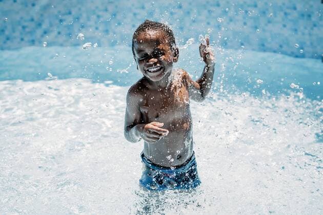 Happy little boy in swimming pool model released Symbolfoto  OCMF00526