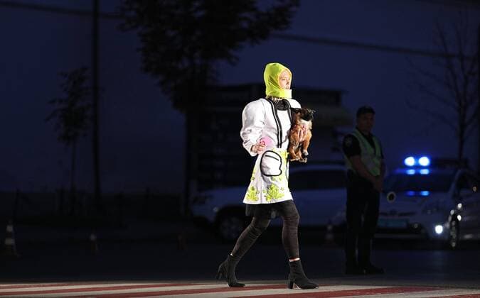 A model walks along a zebra crossing as she wears a creation during the Safe Fashion performance at the Ukrainian Fashion Week SS20, Kyiv, capital of Ukraine, September 4, 2019. The performance showcased outfits by the finalists of the Safe Fashion Contest. Designers were to create collections of clothing and accessories with reflective elements to promote road safety. Ukrinform. Safe Fashion performance raises road safety awareness in Kyiv  Copyright: xDanilxShamkinx