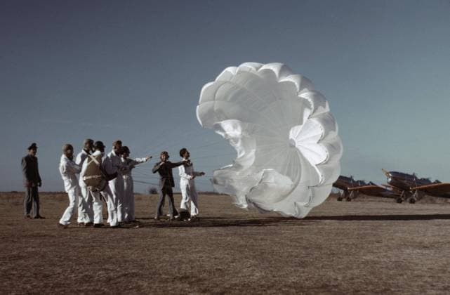 Instructor Explaining Operation of Parachute to Student Pilots, Meacham Field, Fort Worth, Texas, USA, Arthur Rothstein for Farm Security Administration, January 1942  Copyright: CircaxImages ghi-circa01598