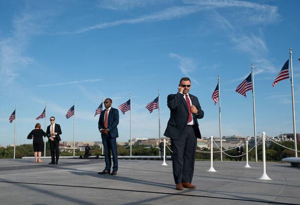 Secret Service agents wait for First Lady Melania Trump to arrive to participate in a ceremony to reopen the Washington Monument in Washington, DC on Thursday, September 19, 2019. The Monument has been closed on and off for renovations and repairs following damage from the 2011 earthquake.  WAP20190919308 KEVINxDIETSCH
