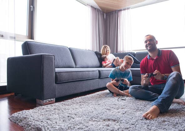 Happy family. Father, mother and children playing a video game Father and son playing video games together on the floor,model released, Symbolfoto ING_32193_135858
