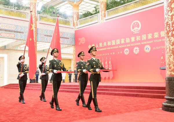 (190929) -- BEIJING, Sept. 29, 2019 -- Guards of honor escort the Medal of the Republic, the Friendship Medal and the Medal for recipients of national honorary titles during the presentation ceremony at the Great Hall of the People in Beijing, capital of China, Sept. 29, 2019. China held the presentation ceremony of the national medals and honorary titles on Sunday at the Great Hall of the People, ahead of the 70th anniversary of the founding of the People s Republic of China (PRC) on Oct. 1. ) CHINA-BEIJING-NATIONAL MEDALS-HONORARY TITLES-PRC FOUNDING-70TH ANNIVERSARY (CN) DingxHaitao 