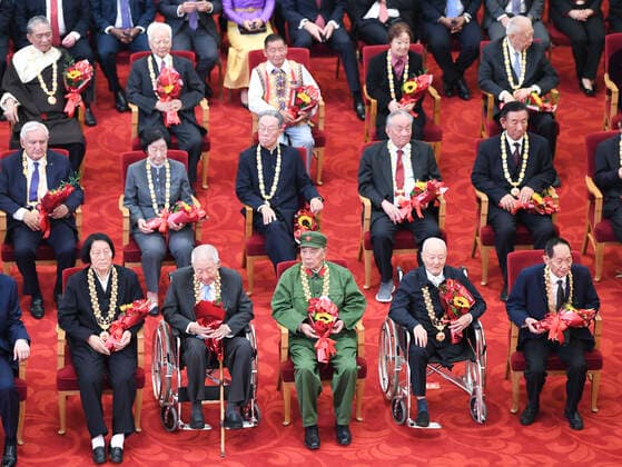 (190929) -- BEIJING, Sept. 29, 2019 -- Awardees of national medals and honorary titles attend the presentation ceremony at the Great Hall of the People in Beijing, capital of China, Sept. 29, 2019. China held the presentation ceremony of the national medals and honorary titles on Sunday at the Great Hall of the People, ahead of the 70th anniversary of the founding of the People s Republic of China (PRC) on Oct. 1. ) CHINA-BEIJING-NATIONAL MEDALS-HONORARY TITLES-PRC FOUNDING-70TH ANNIVERSARY (CN) YinxBogu 