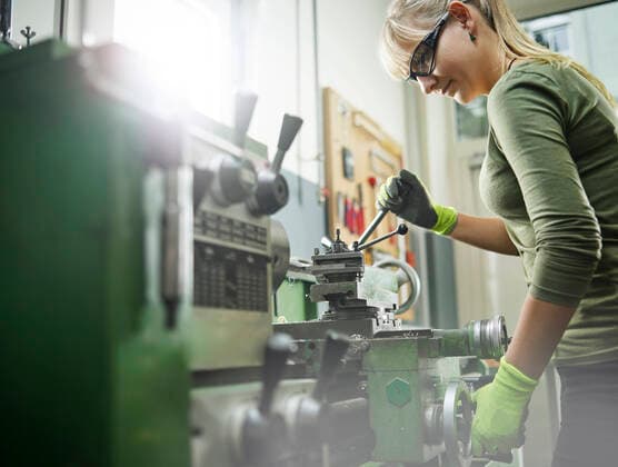 Woman working at a lathe model released Symbolfoto property released  CVF01459