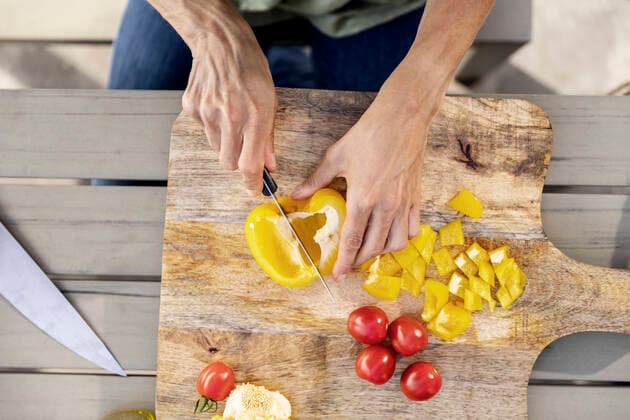 Close-up of woman preparing healthy food outdoors model released Symbolfoto property released  FMKF05781