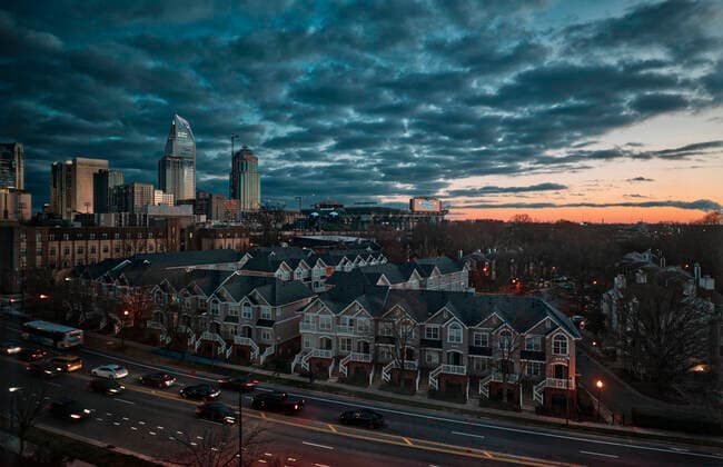 Buildings in Charlotte against cloudy sky during sunset  LOMF00878
