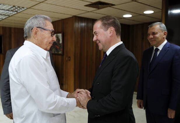 HAVANA, CUBA â€“ OCTOBER 3, 2019: Cuban Communist Party Leader Raul Castro (L), Russia s Prime Minister Dmitry Medvedev, and his deputy Yuri Borisov (R-L) during a meeting. Dmitry Astakhov POOL TASS  TS0BD8CB