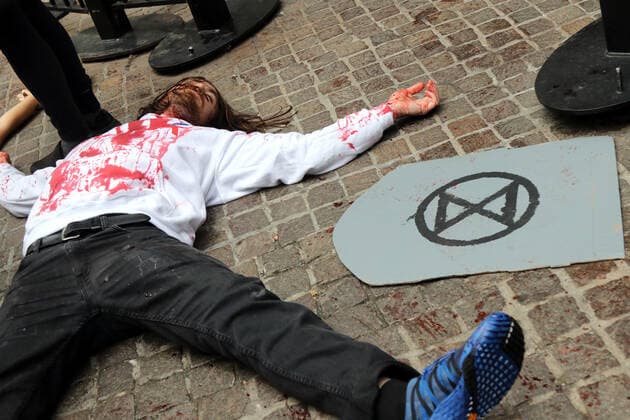 October 7, 2019, New York City, New York, US: Climate action group Extinction Rebellion launched a series of climate change protests around the globe on 7 October 2019, that featured large numbers of New York climate activists descending on lower Manhattan in actions that saw the iconic Charging Bull statute showered In Fake Blood and a die-in at the New York Stock Exchange on Wall Street, resulted in many arrests. New York City US - ZUMAl135 20191007_zap_l135_026 Copyright: xG.xRonaldxLopezx