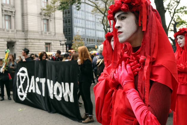 October 7, 2019, New York City, New York, US: Climate action group Extinction Rebellion launched a series of climate change protests around the globe on 7 October 2019, that featured large numbers of New York climate activists descending on lower Manhattan in actions that saw the iconic Charging Bull statute showered In Fake Blood and a die-in at the New York Stock Exchange on Wall Street, resulted in many arrests. New York City US - ZUMAl135 20191007_zap_l135_028 Copyright: xG.xRonaldxLopezx