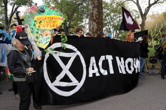 October 7, 2019, New York City, New York, US: Climate action group Extinction Rebellion launched a series of climate change protests around the globe on 7 October 2019, that featured large numbers of New York climate activists descending on lower Manhattan in actions that saw the iconic Charging Bull statute showered In Fake Blood and a die-in at the New York Stock Exchange on Wall Street, resulted in many arrests. New York City US - ZUMAl135 20191007_zap_l135_018 Copyright: xG.xRonaldxLopezx