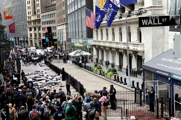 October 7, 2019, New York City, New York, US: Climate action group Extinction Rebellion launched a series of climate change protests around the globe on 7 October 2019, that featured large numbers of New York climate activists descending on lower Manhattan in actions that saw the iconic Charging Bull statute showered In Fake Blood and a die-in at the New York Stock Exchange on Wall Street, resulted in many arrests. New York City US - ZUMAl135 20191007_zap_l135_007 Copyright: xG.xRonaldxLopezx