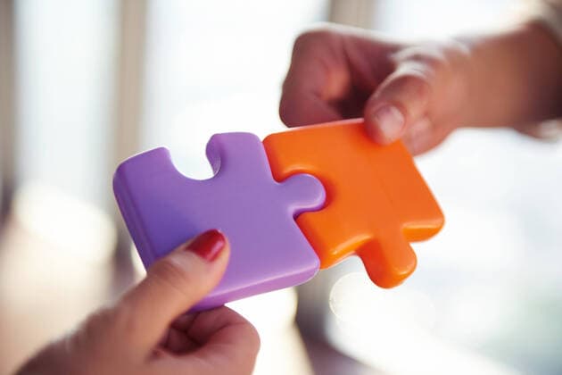 business people group assembling jigsaw puzzle and represent team support and help concept, top view perspective at modern bright office interior,model released, Symbolfoto ING_32193_105808
