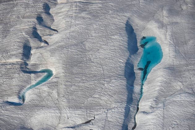 Aerial view of meltwater channels in ice, Axel Heiberg Island, Nunavut, Canada, August 2007.  1533588 PalxHermansen