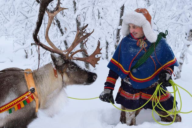Reindeer sledding in - 25 C, with Nils-Torbjorn Nutti, owner and operator of Nutti Sami Siida, Jukkasjarvi, Lapland, Laponia, Norrbotten county, Sweden Model released.  1558998 StaffanxWidstrand