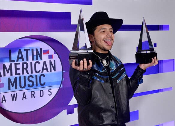 Christian Nodal appears backstage with his awards for Favorite Artist and Favorite Song-Regional Mexican for No Te Contaron Mai during the fifth annual Latin American Music Awards at the Dolby Theatre in the Hollywood section of Los Angeles on Thursday, October 17, 2019. The annual event honors outstanding achievements for artists in the Latin music industry.  LAP20191017392 JIMxRUYMEN