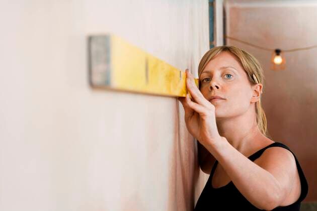 Woman Using Level,model released, Symbolfoto,property released 03B74025
