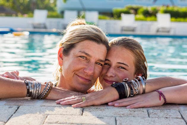 mother and her 13 year old daughter in pool smiling mother and her 13 year old daughter in pool smiling  58787