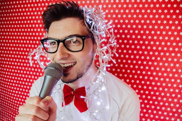Young man at a christmas party,model released, Symbolfoto INH_61508_00384