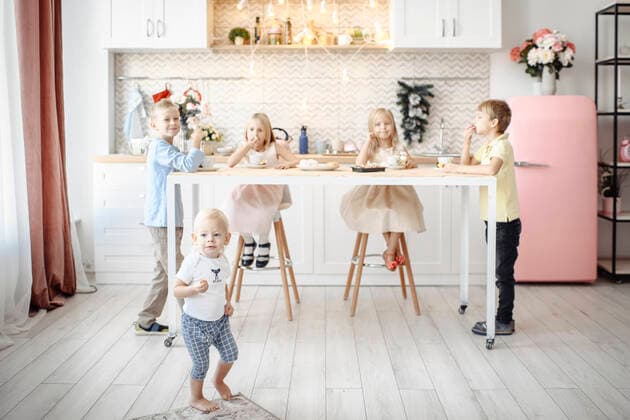 Creative Highlights Symbolfotos Fivechildren eating cookies in the kitchen model released Symbolfoto property released  EYAF00572